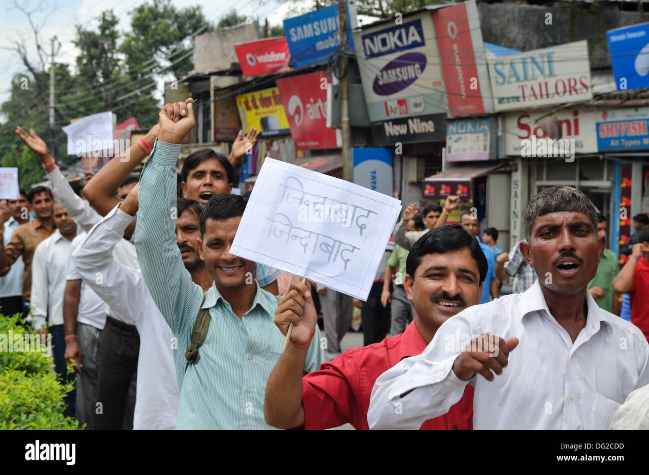 Indian demonstrators hold placards with the Hindi inscription reading