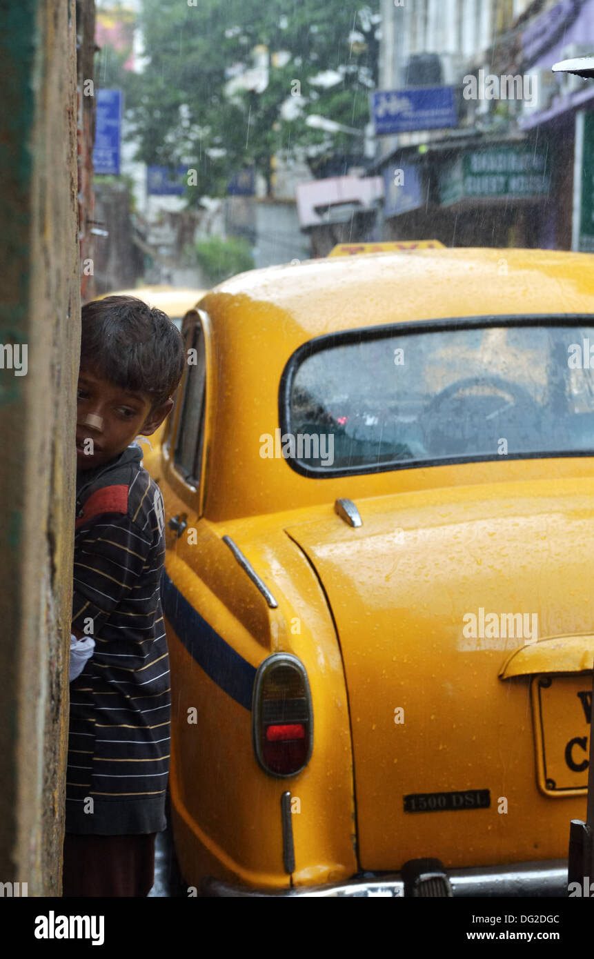 Boy under the rain, Kolkata, India Stock Photo Alamy