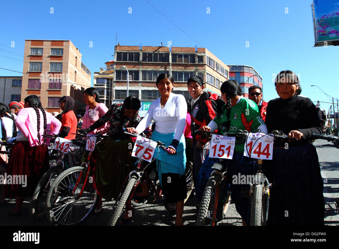 El Alto, Bolivia. 12th Oct, 2013.  Competitors line up before the start of a Cholitas Bicycle Race for indigenous Aymara women. The race is held at an altitude of just over 4,000m along main roads in the city of El Alto (above La Paz) for Bolivian Womens Day, which was yesterday Friday October 11th. Credit:  James Brunker / Alamy Live News Stock Photo