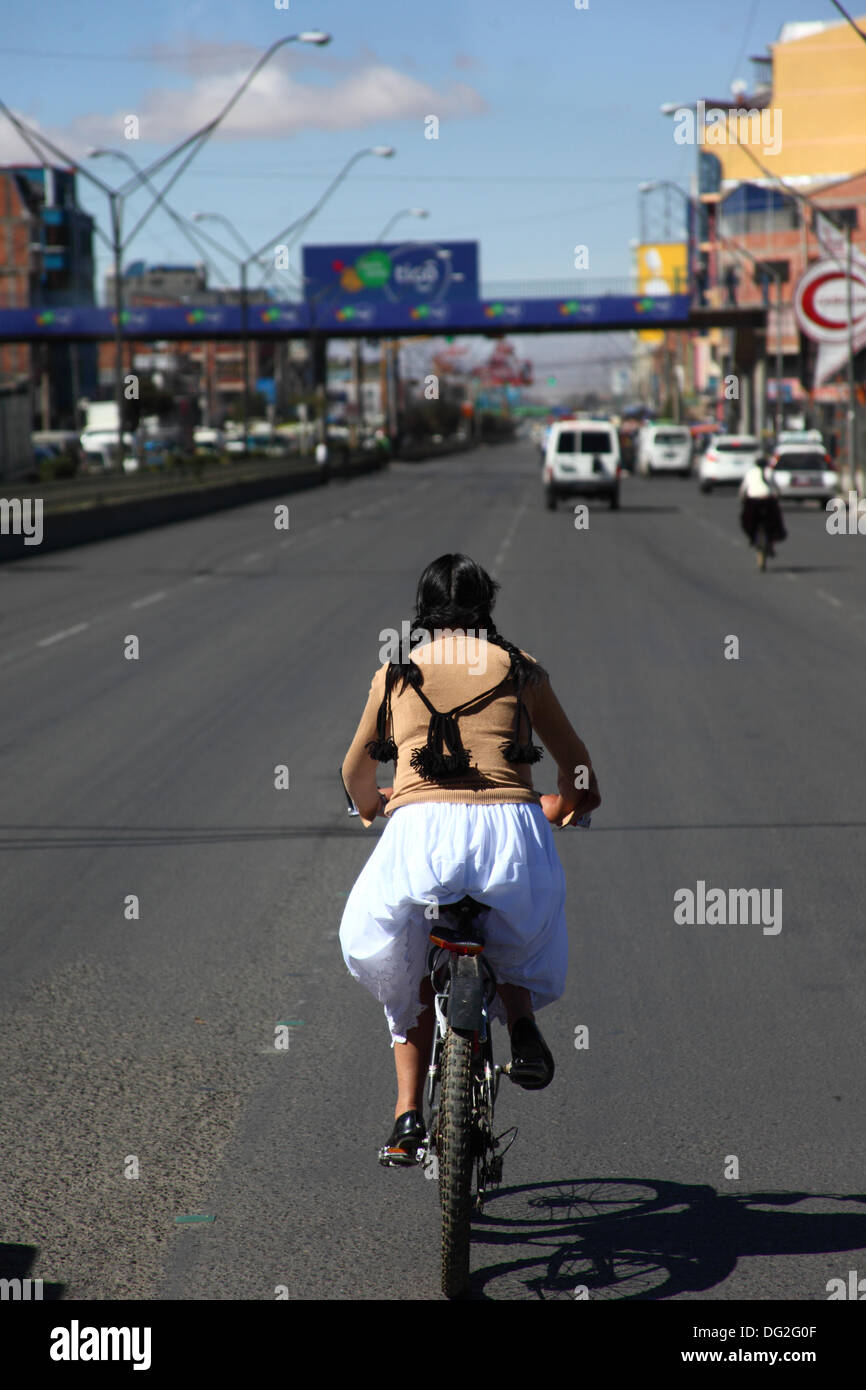 El Alto, Bolivia. 12th Oct, 2013.  A competitor taking part in a Cholitas Bicycle Race for indigenous Aymara women. The race is held at an altitude of just over 4,000m along main roads in the city of El Alto (above the capital, La Paz) for Bolivian Womens Day, which was yesterday Friday October 11th. Credit:  James Brunker / Alamy Live News Stock Photo