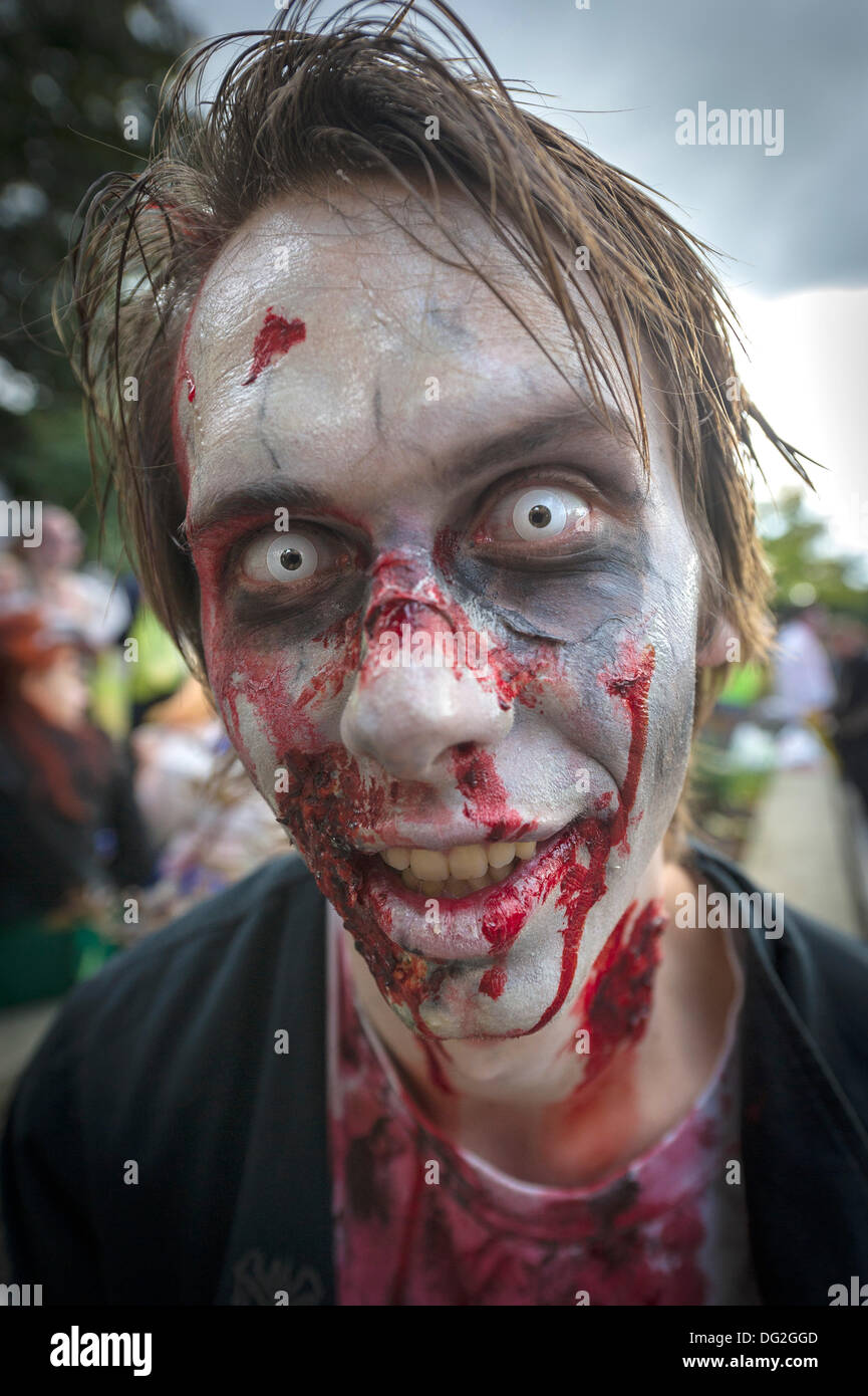 October 12th 2013 A participant in the annual Zombie Invasion of London finishing his makeup.  Photographer: Gordon Scammell/Alamy Live News Stock Photo
