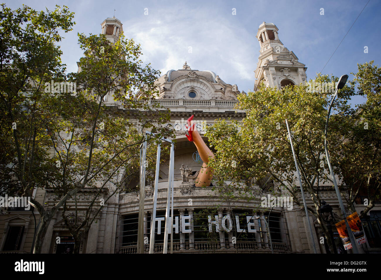 Huge woman inflatable legs at the facade of a theater (Coliseum 'The Hole') in Barcelona, Spain. Stock Photo