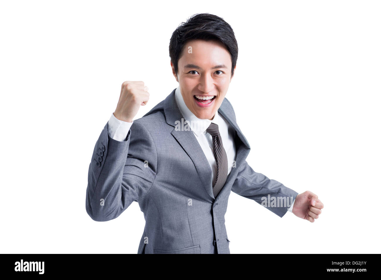 Excited businessman punching the air Stock Photo Alamy
