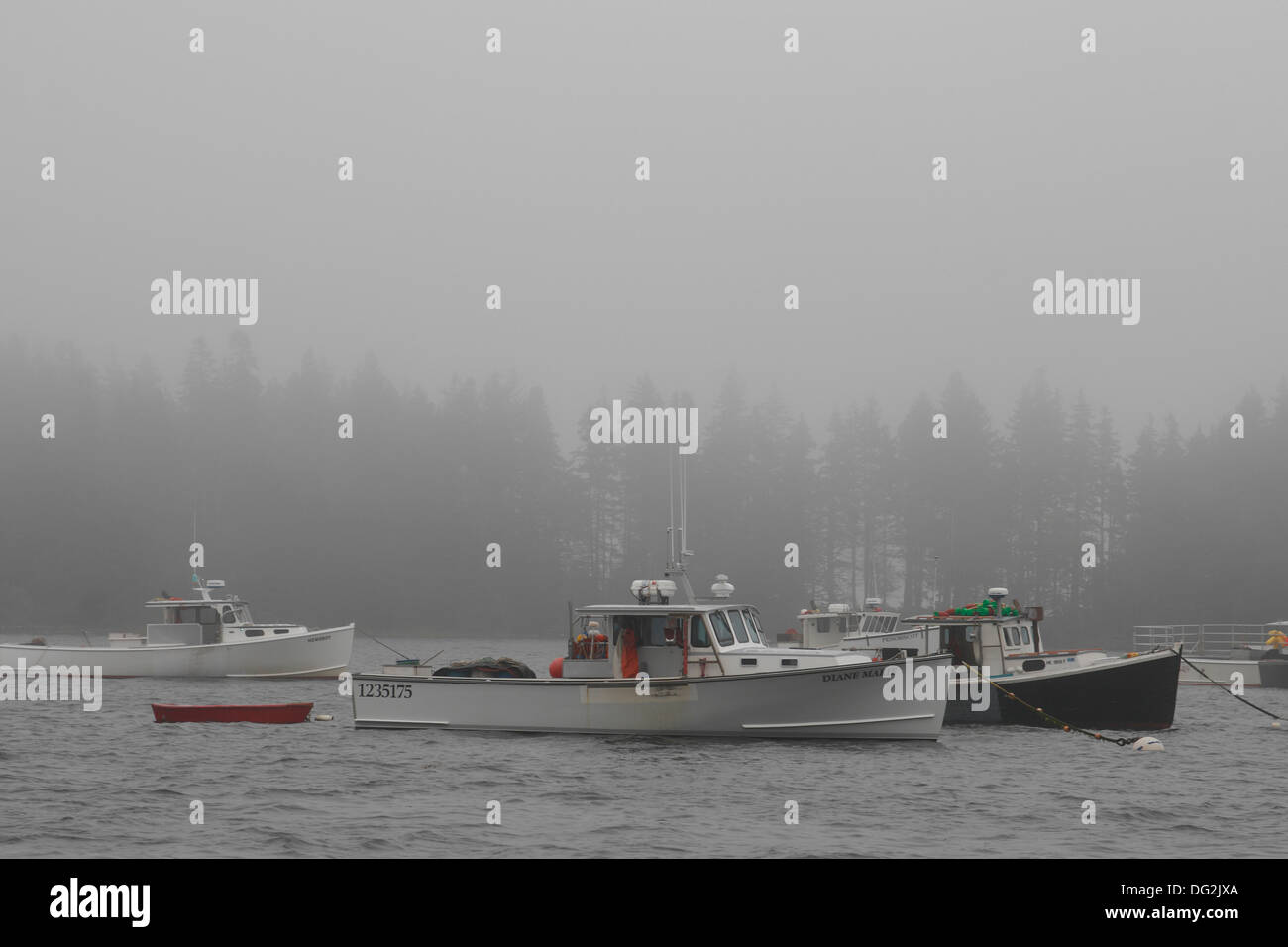 Lobster boat fleet in fog Owl's Head Maine Coast New England USA Stock