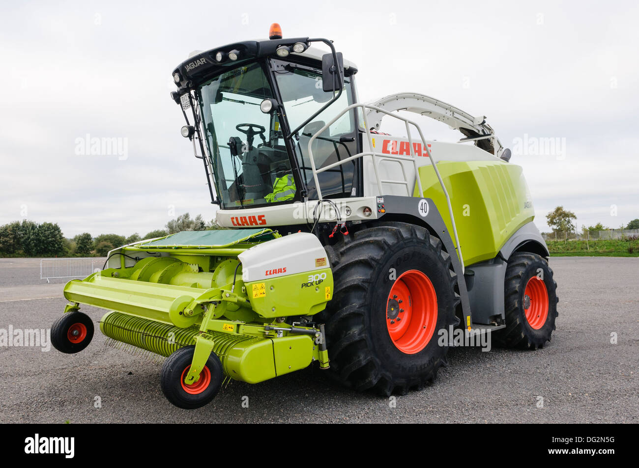 Claas 960 Jaguar forage harvester with 300 Pick Up head Stock Photo