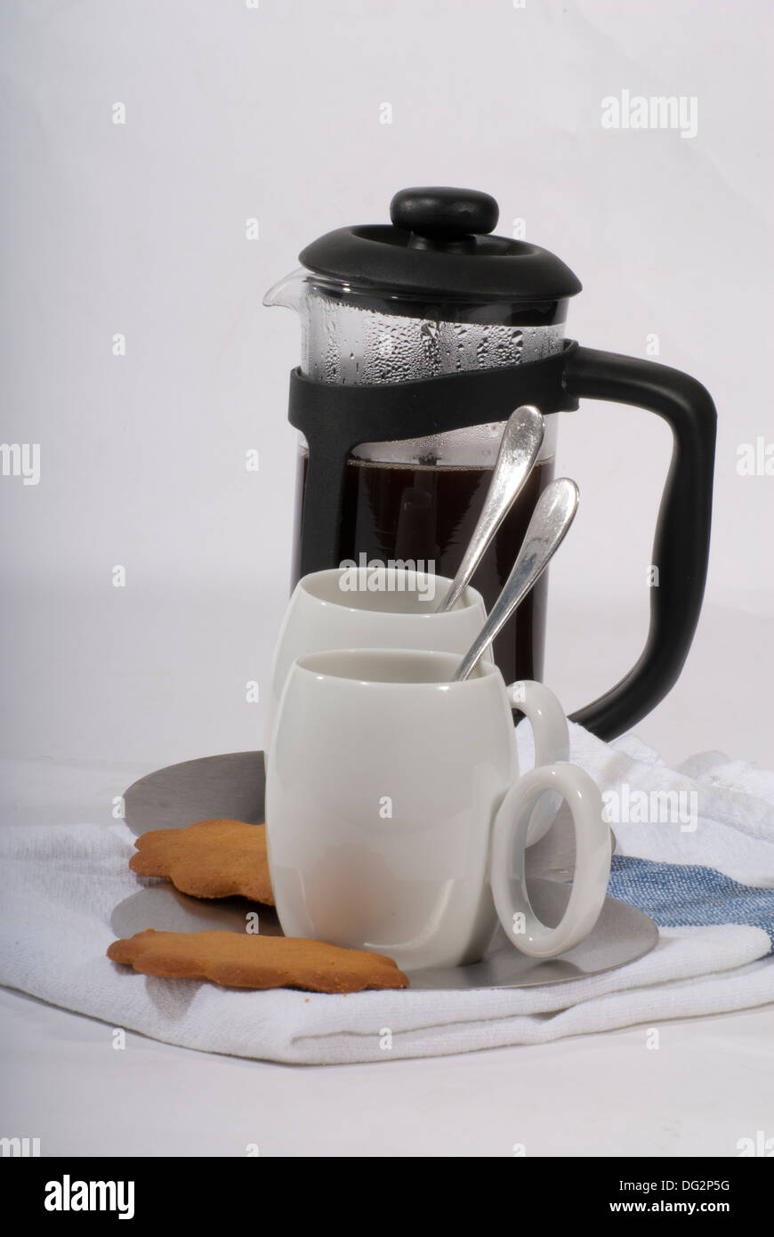 Coffee,traditional French press coffee maker and small white cups with