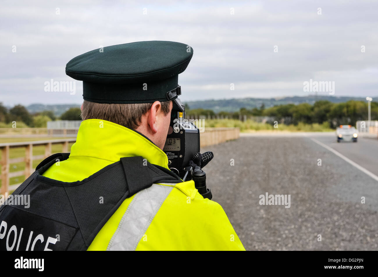 Police officer uses a Laser Technology Inc UltraLyte laser speed