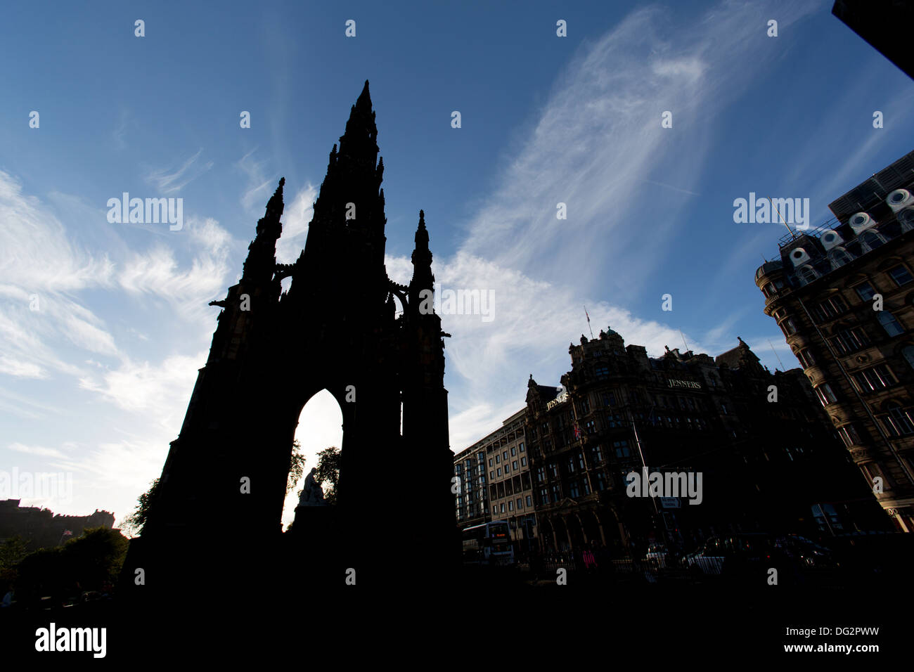 City of Edinburgh, Scotland. Silhouetted view of Princes Street with the Scott Monument in the foreground. Stock Photo
