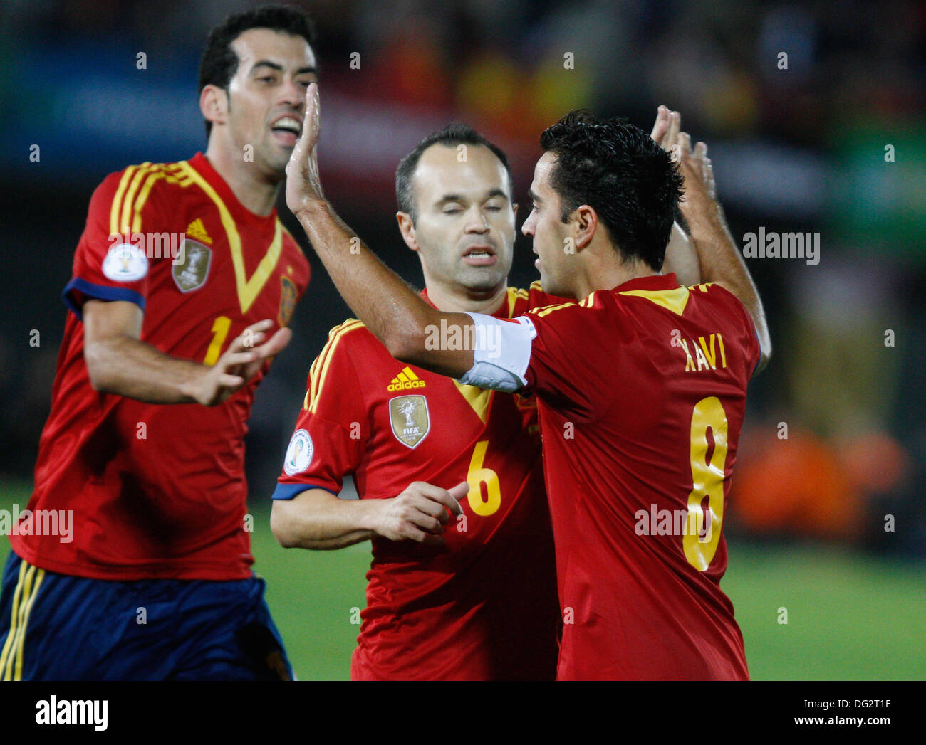 Palma de Mallorca, Spain, 12th Oct 2013, Spain«s soccer national team players Xavi (L) Iniesta (C) and Arbeloa celebrate after scoring a goal during their 2014 World Cup qualifying soccer match against Belarus at Son Moix stadium in Palma de Mallorca on friday 11th October. Zixia/Alamy Live News. Stock Photo