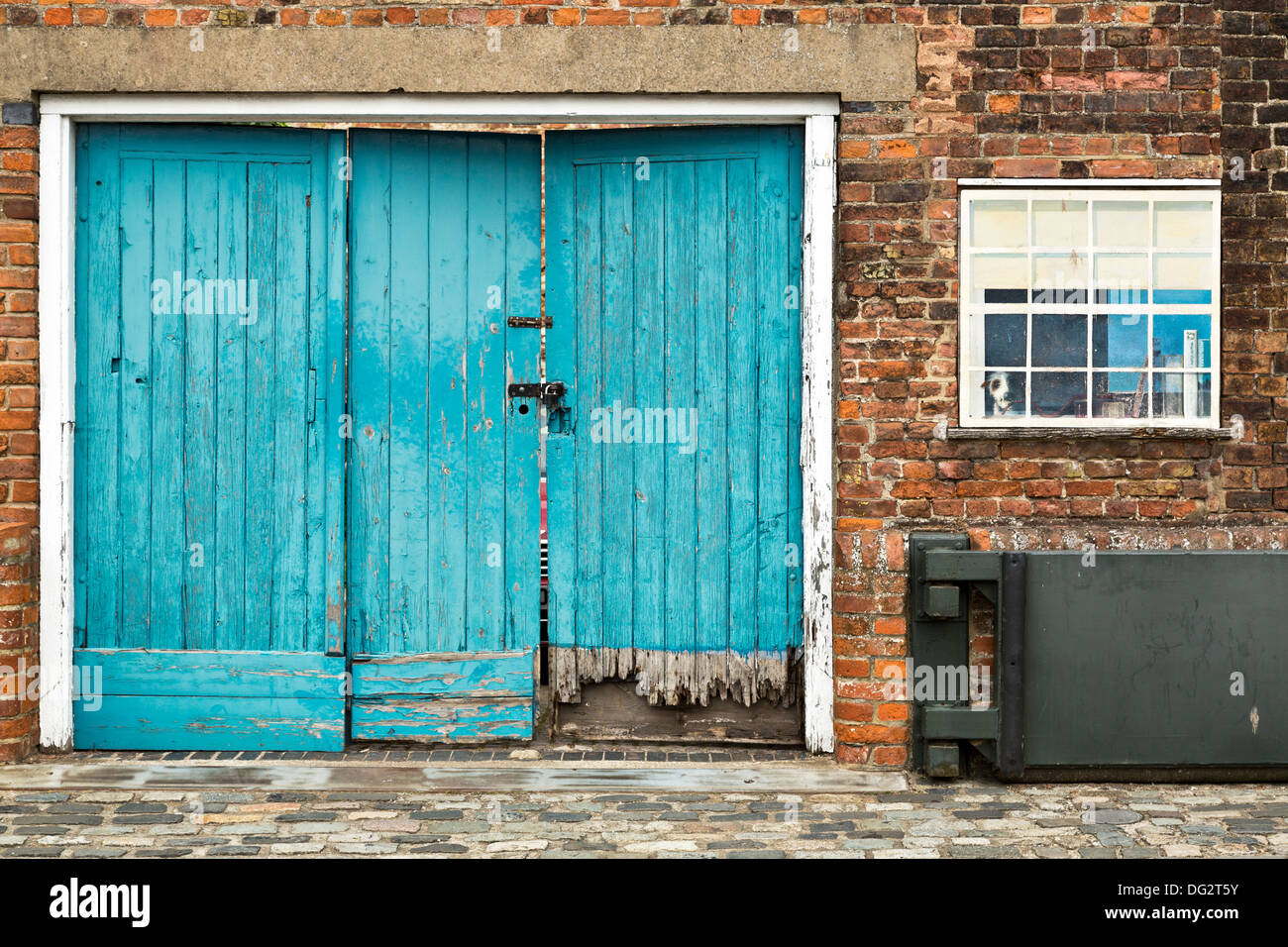 Old water damaged wooden door in King's Lynn, Norfolk, England Stock