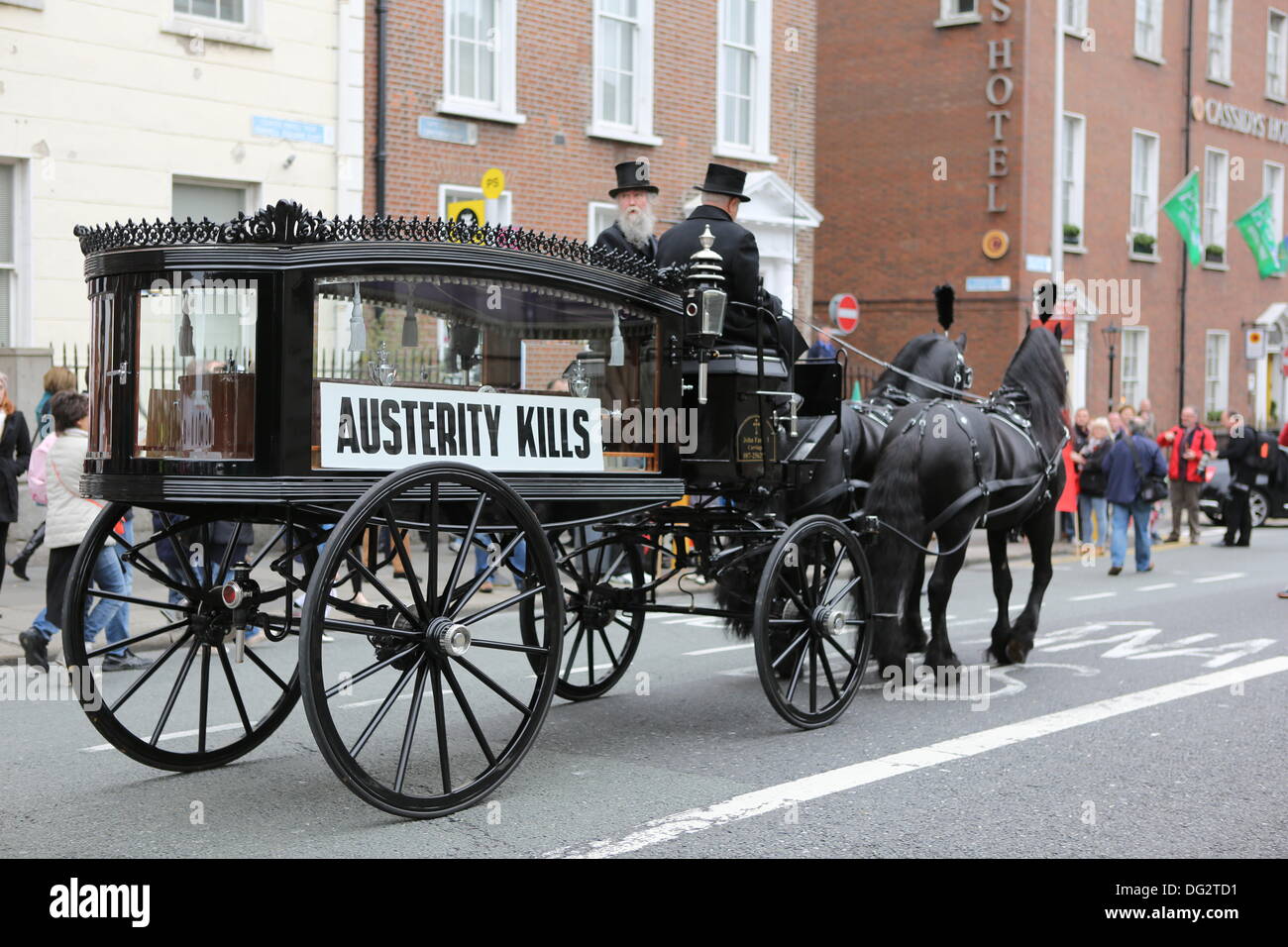 Dublin, Ireland. 12th October 2013. A horse drawn hearse leads the protest march, signifying the death through austerity measures. Unions called for a protest march through Dublin, ahead of the announcing of the 2014 budget next week. They protested against cuts in Social Welfare, Health and Education and for an utilisation of alternative revenue sources by the government. © Michael Debets/Alamy Live News Stock Photo