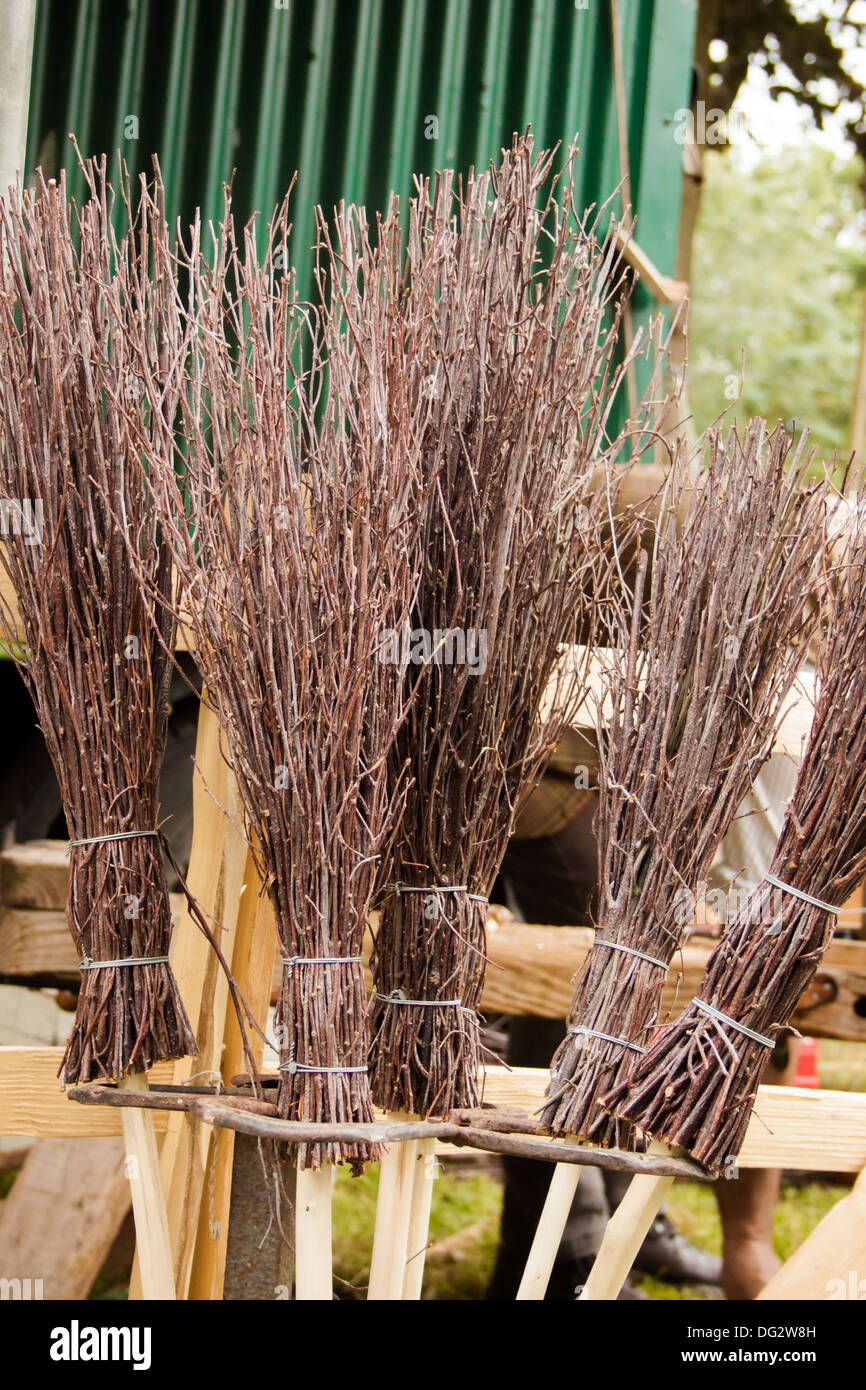 traditional broomsticks for sale at a country fair Stock Photo