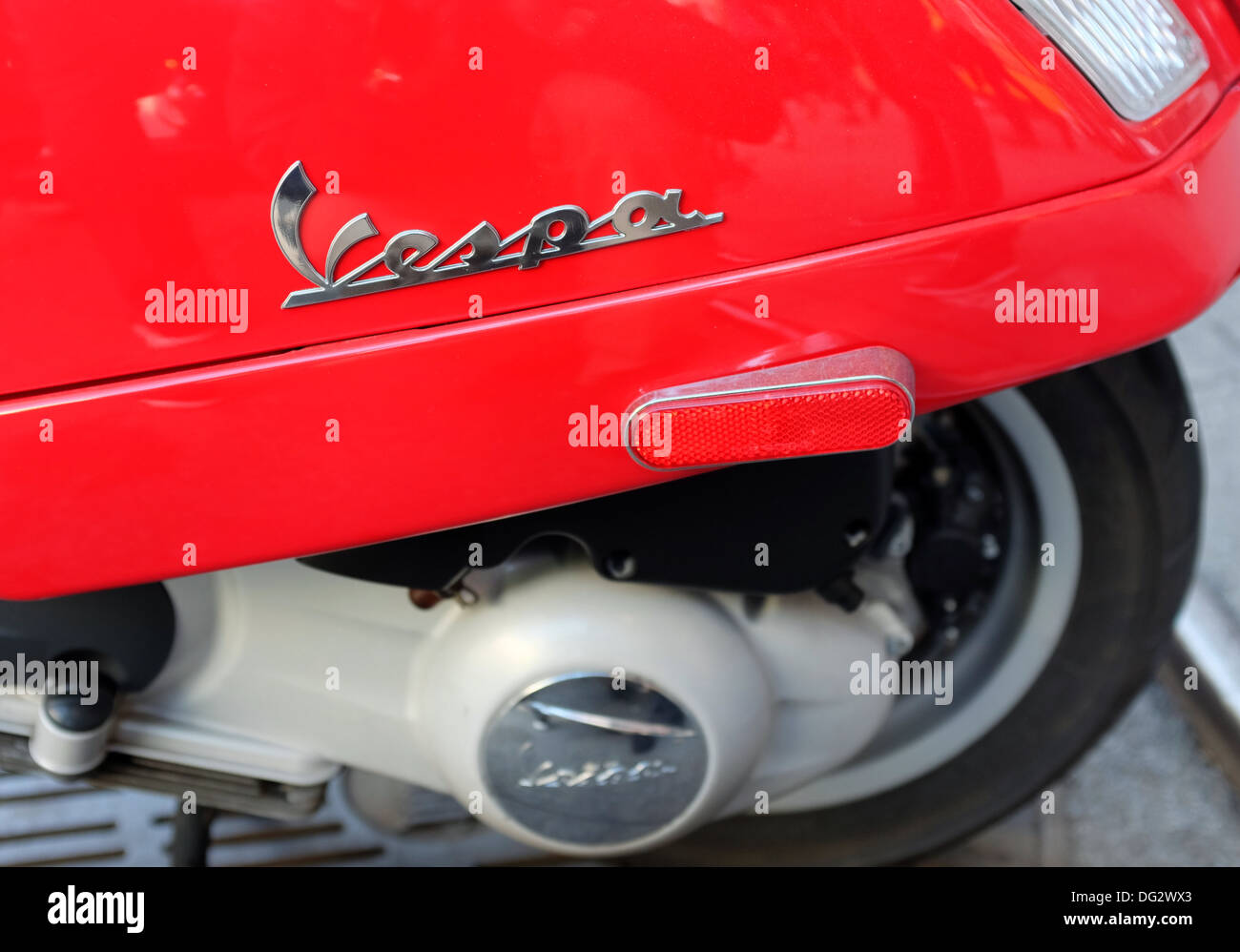 Detail of Vespa logo on red Vespa scooter. Stock Photo