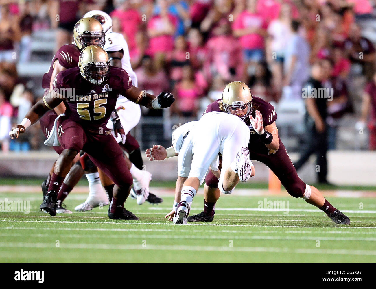 San Marcos, TX, USA. 12th Oct, 2013. Texas State linebacker David Mayo #3 ULM quarterback Brayle Brown #12 during NCAA football game at Jim Wacker Field in San Marcos, TX. ULM leads Texas State 7-0 at the halftime. © csm/Alamy Live News Stock Photo
