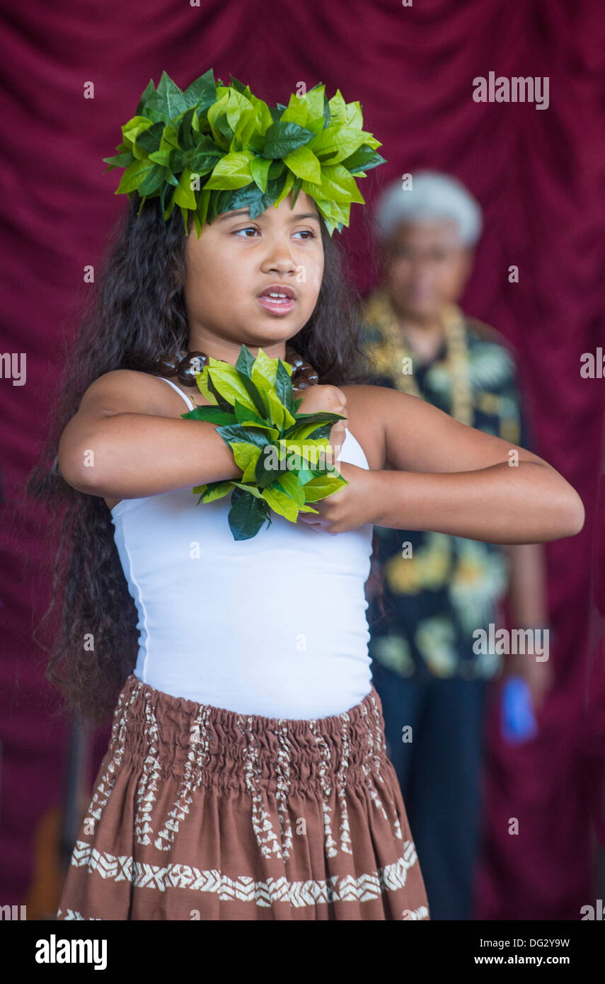 Dancer with traditional dress performs Hawaiian dance in the 23rd