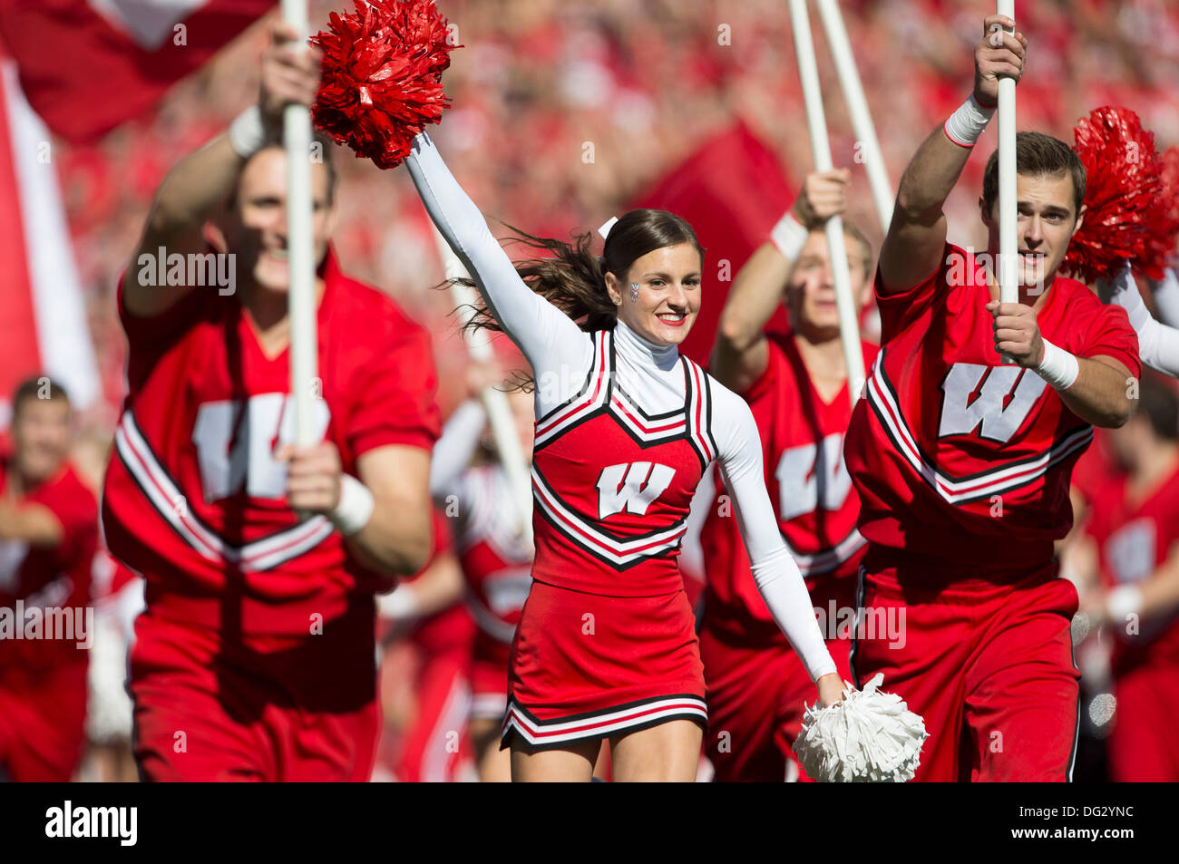 Madison, Wisconsin, USA. 12th Oct, 2013. October 12, 2013: A Wisconsin Badgers cheerleader runs onto the field ahead of the team prior to the start of the NCAA Football game between the Northwestern Wildcats and the Wisconsin Badgers at Camp Randall Stadium in Madison, WI. Wisconsin defeated Northwestern 35-6. John Fisher/CSM/Alamy Live News Stock Photo