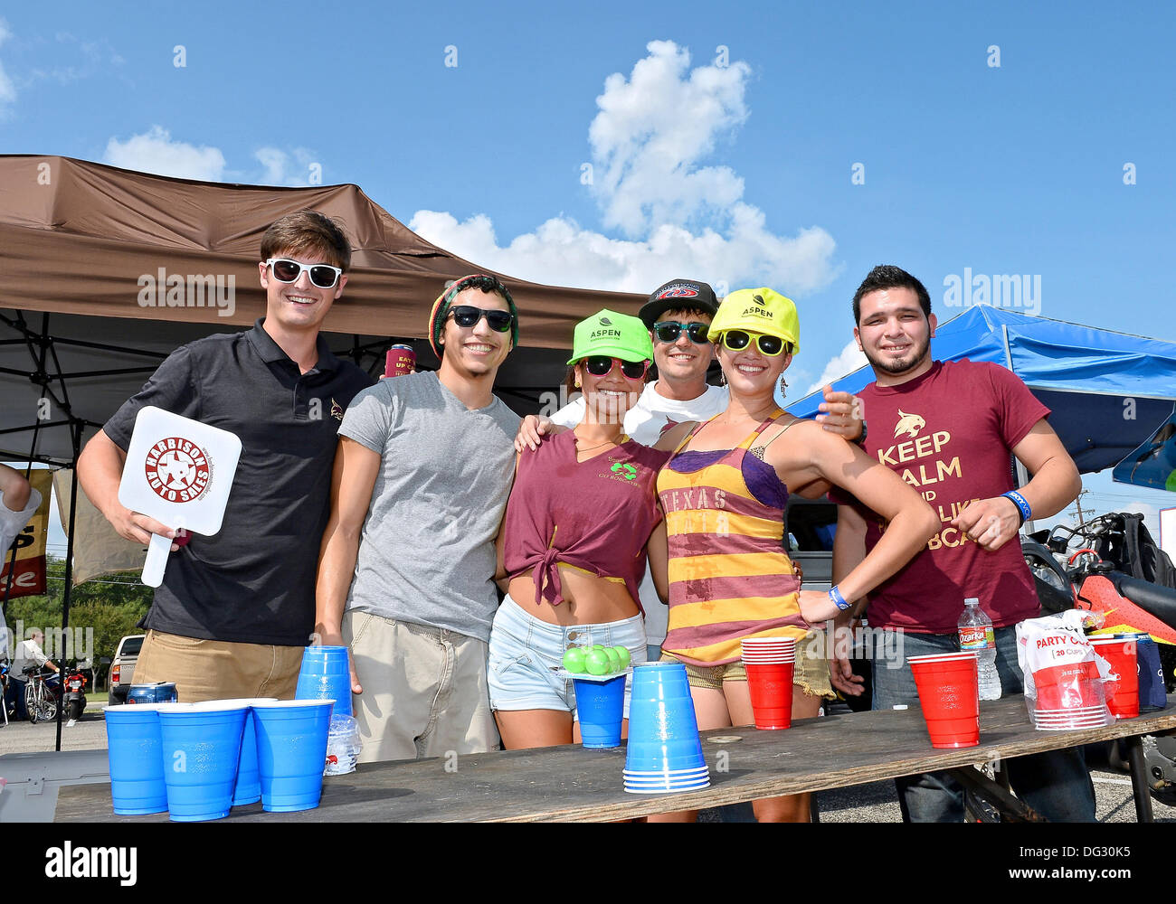 San Marcos, TX, USA. 12th Oct, 2013. Texas State tailgaters pose for a photograph before NCAA football game at Jim Wacker Field in San Marcos, TX. ULM defeat Texas State 21-14. © csm/Alamy Live News Stock Photo