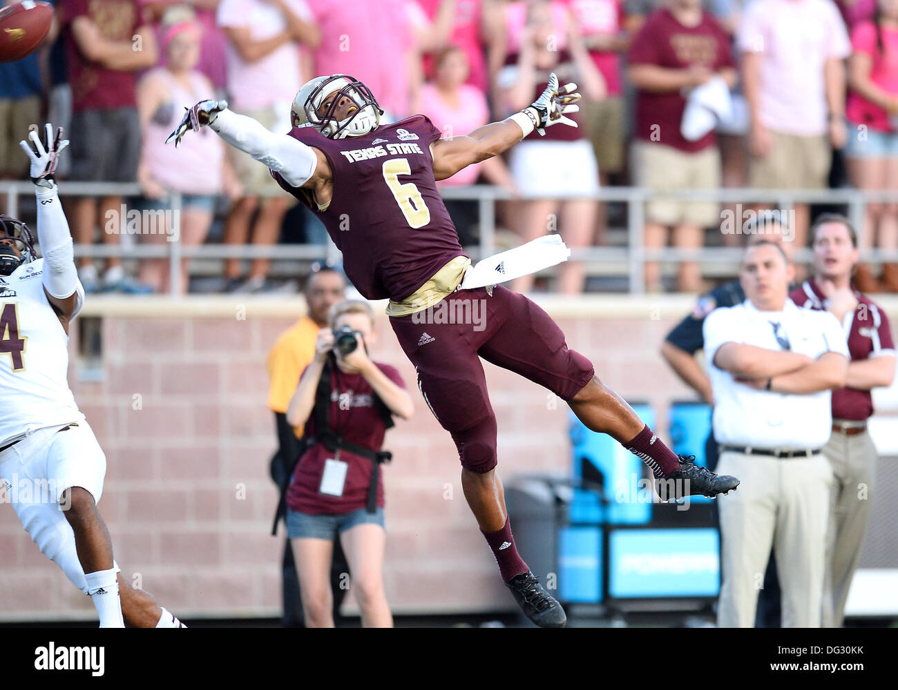 San Marcos, TX, USA. 12th Oct, 2013. Texas State wide receiver Isaiah Battle #6 leaps to catch an over thrown pass during NCAA football game at Jim Wacker Field in San Marcos, TX. ULM defeat Texas State 21-14. © csm/Alamy Live News Stock Photo