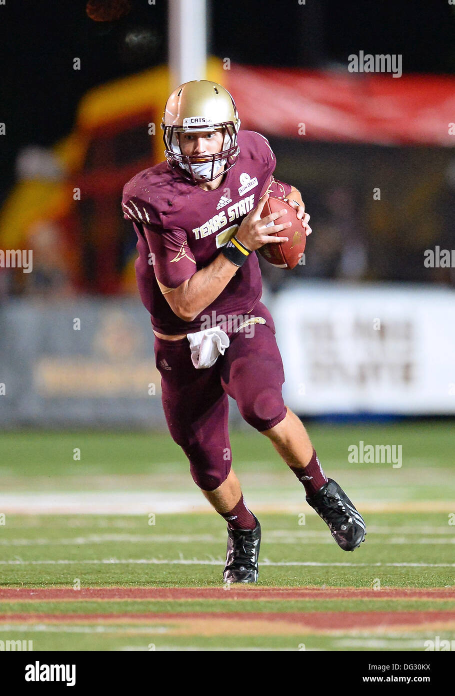 San Marcos, TX, USA. 12th Oct, 2013. Texas State quarterback Tyler Jones #2 rushes for some yards during NCAA football game at Jim Wacker Field in San Marcos, TX. ULM defeat Texas State 21-14. © csm/Alamy Live News Stock Photo