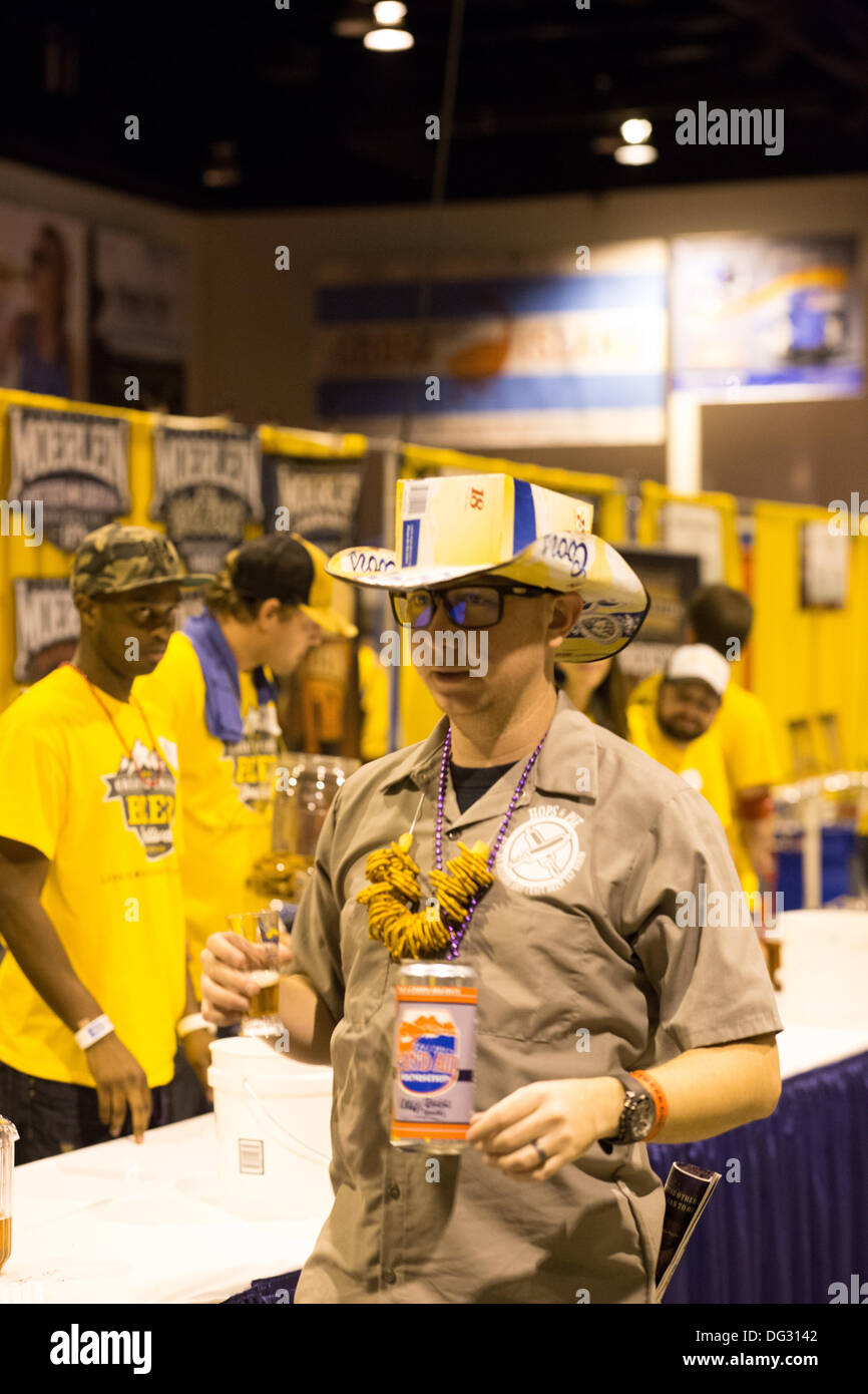 Denver, CO  Oct. 12, 2013. A participant of the 2013 Great American Beer Fest wearing a cardboard Coors hat and wearing a necklace of pretzels prepares to  sample one of the 4,809 beer entries from 745 breweries from all over the US and Washington DC. © Ed Endicott/Alamy Live News Stock Photo