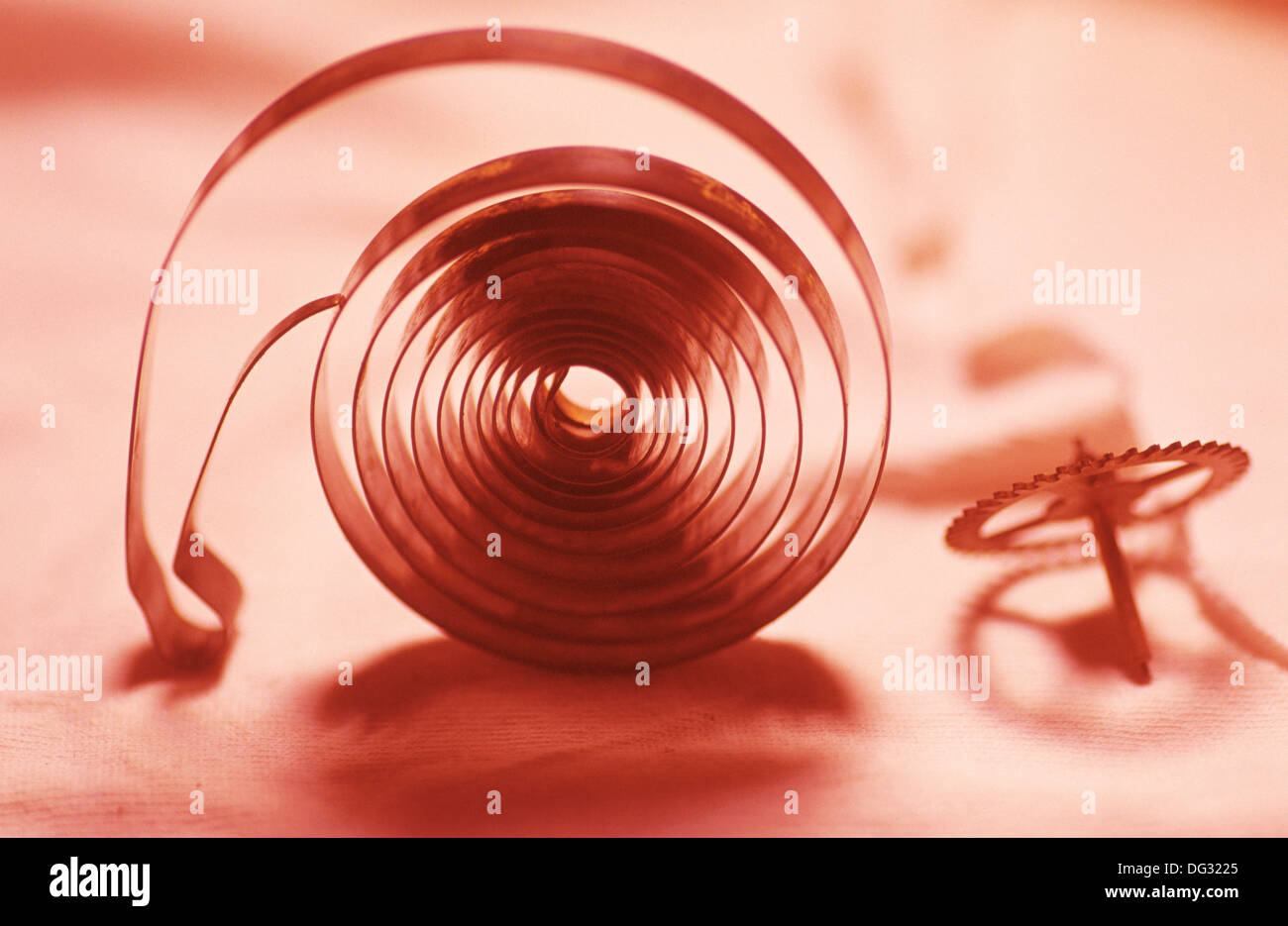 Clock spring and gear wheels Stock Photo Alamy