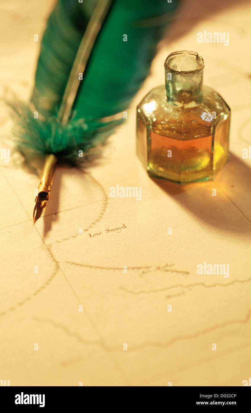 Quill and ink bottle on 19th century map Stock Photo Alamy