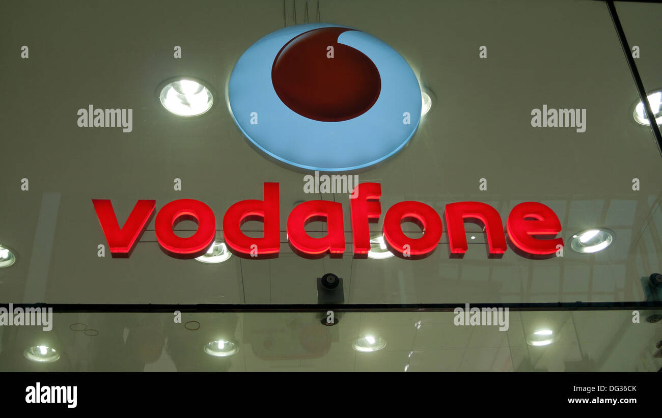 Vodafone sign and logo in shop window UK Stock Photo