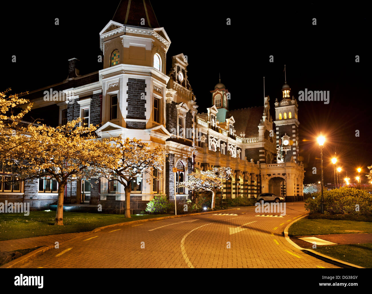 Dunedin, Otago, South Island, New Zealand. A night view of the famous railway station designed by Sir George Troup. Stock Photo