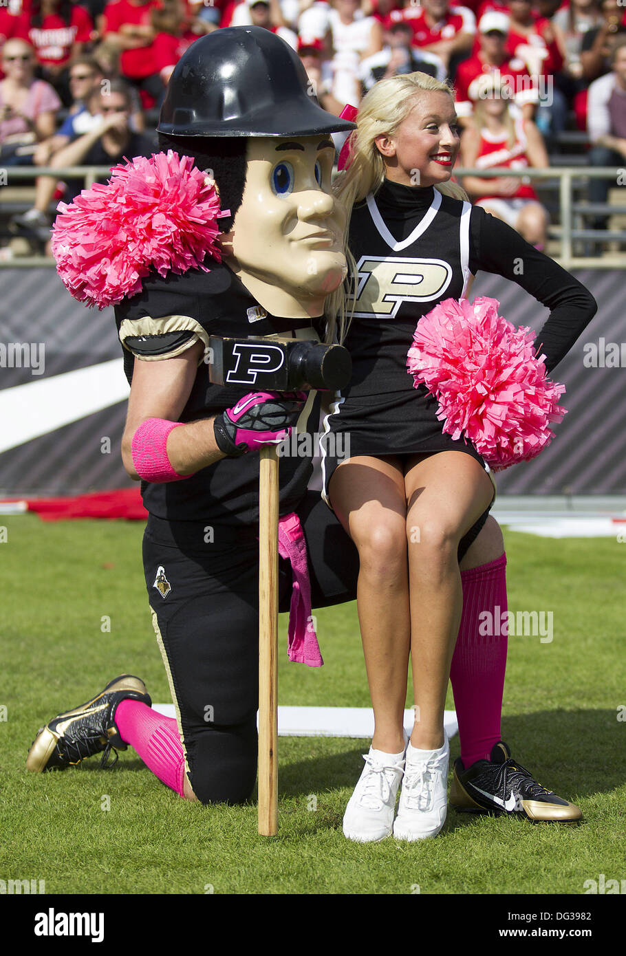 West Lafayette, Indiana, USA. 12th Oct, 2013. October 12, 2013: Purdue cheerleader and mascot during NCAA Football game action between the Nebraska Cornhuskers and the Purdue Boilermakers at Ross-Ade Stadium in West Lafayette, Indiana. Nebraska defeated Purdue 44-7. © csm/Alamy Live News Stock Photo