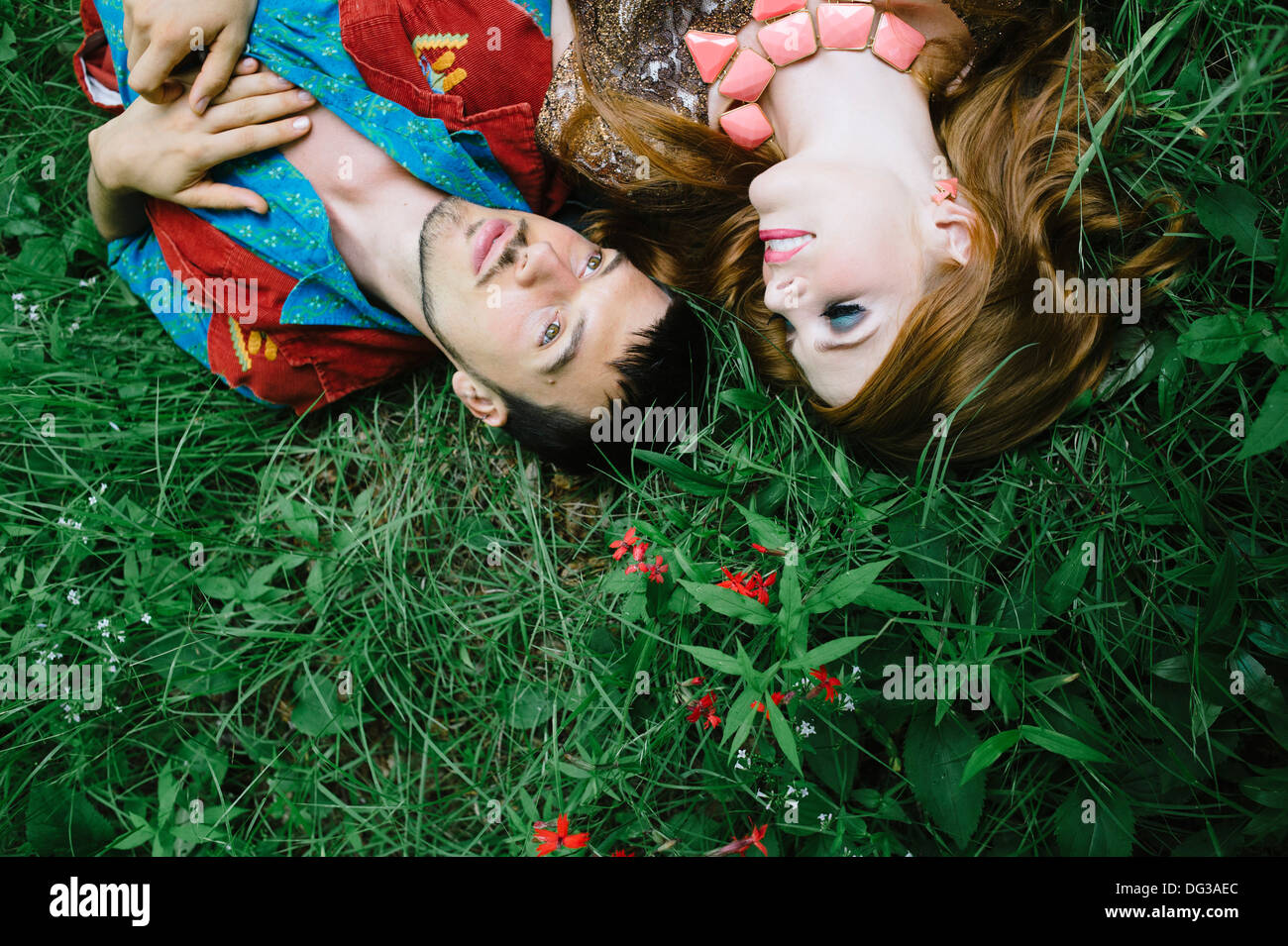 Couple Laying on Grass Field, Close Up, High  Angle View Stock Photo