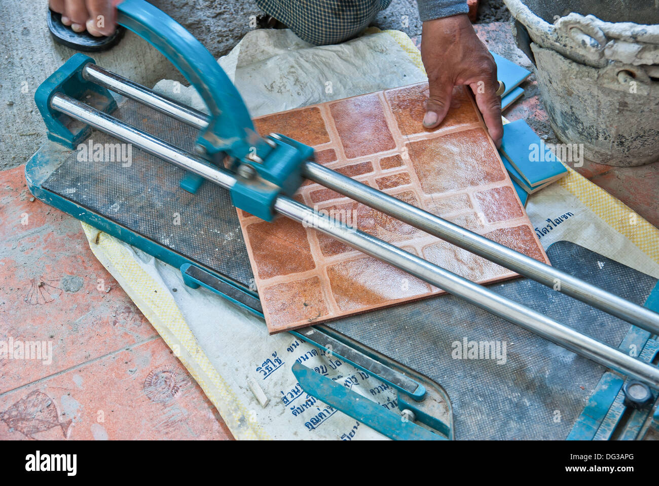 Man Cut the tile Stock Photo