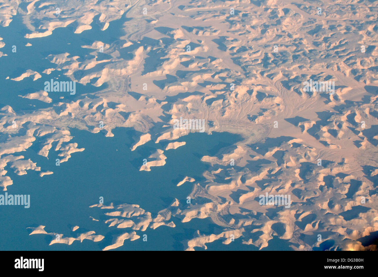 Dramatic sunlit aerial view of desert dunes and Gulf of Aden Arabian Sea Stock Photo