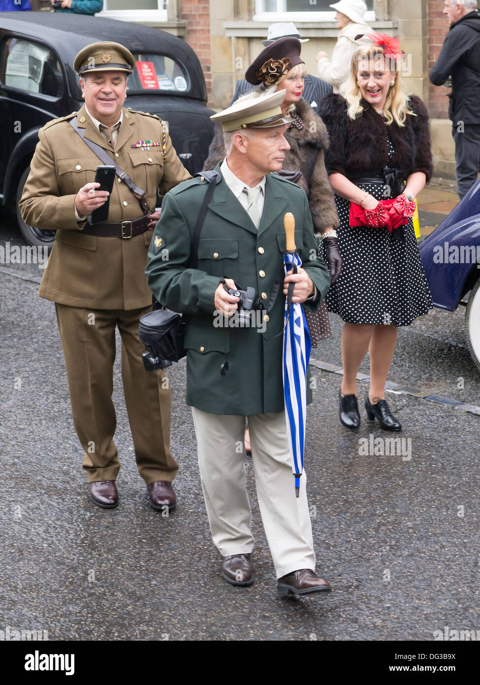 Couples in Pickering North Yorkshire England UK for Wartime and 1940's weekend 2013 men dressed as American and British officers Stock Photo
