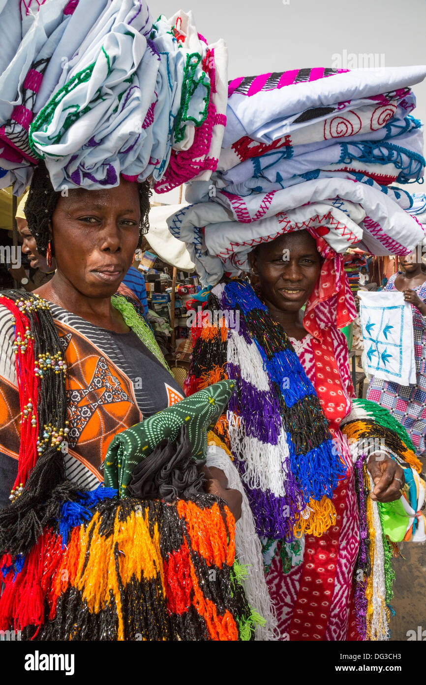 Senegal, Touba. Women Selling Cloth in the Market. Stock Photo