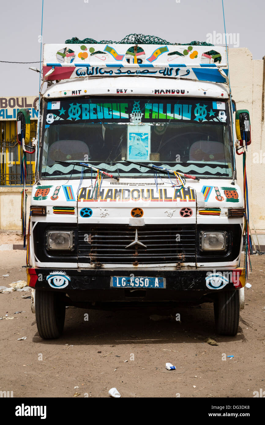 Senegal, Touba. Inter-city transport bus. 'Alhamdoulilahi' is Arabic for 'Praise be to God.' an expression of thanksgiving. Stock Photo