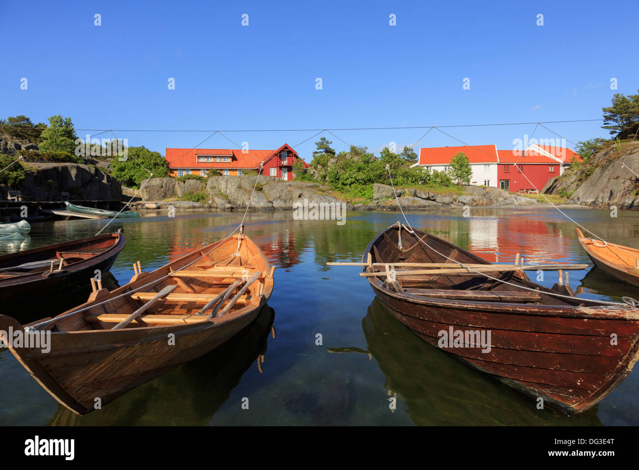 Small rowing boats tied up in a rocky cove on the south coast near Hovag,  Kristiansand, Norway, Scandinavia Stock Photo - Alamy