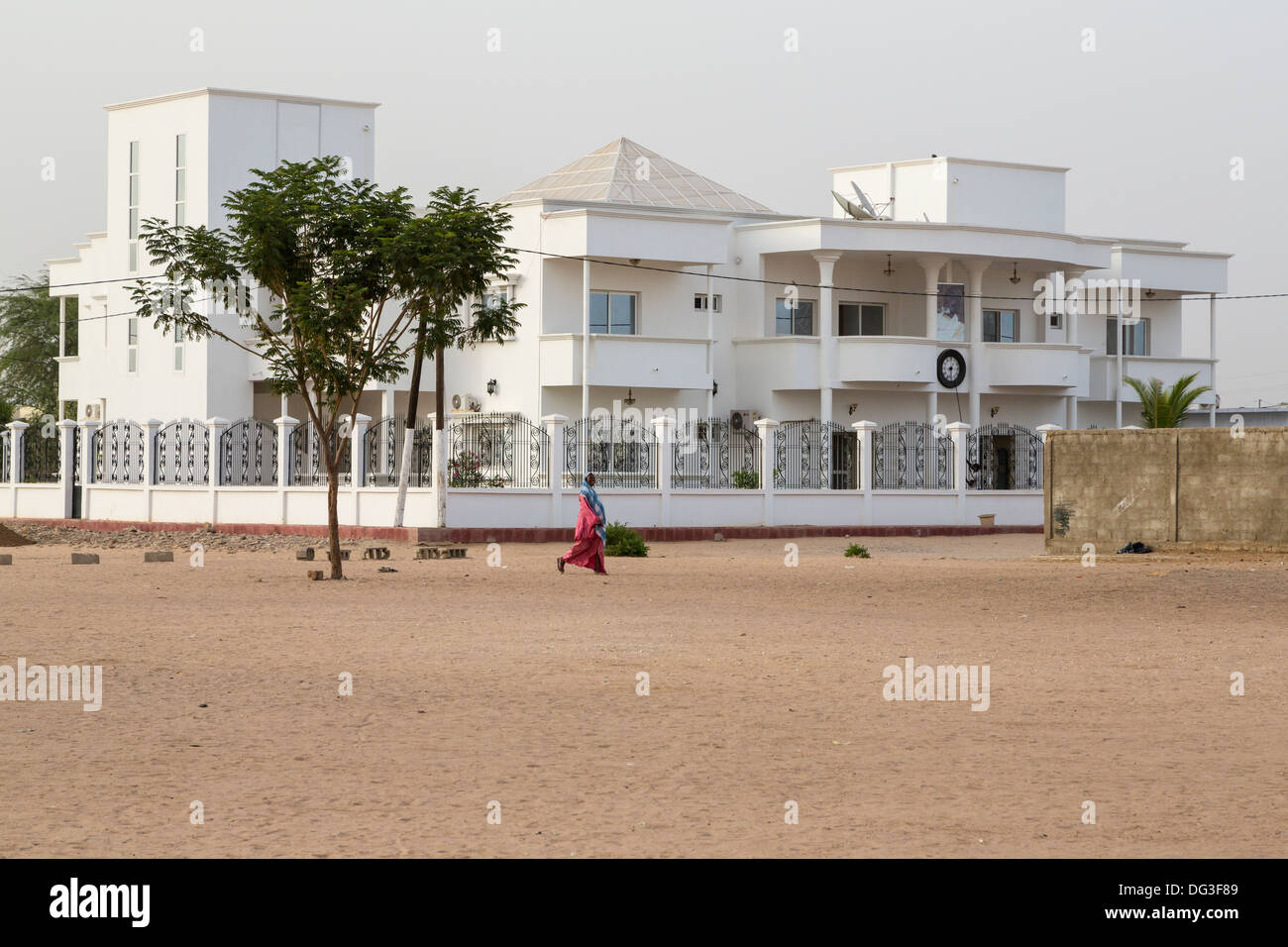 Senegal, Touba. Modern House with a Religious Leader's Picture above the Entrance. Stock Photo