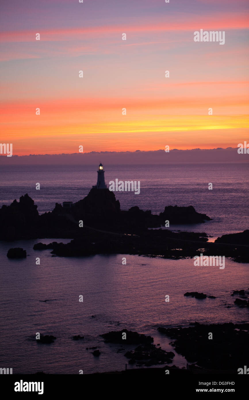 Corbiere Point and Lighthouse. St. Brelade. SW. Jersey, Channel Islands. UK. August evening sunset. Stock Photo