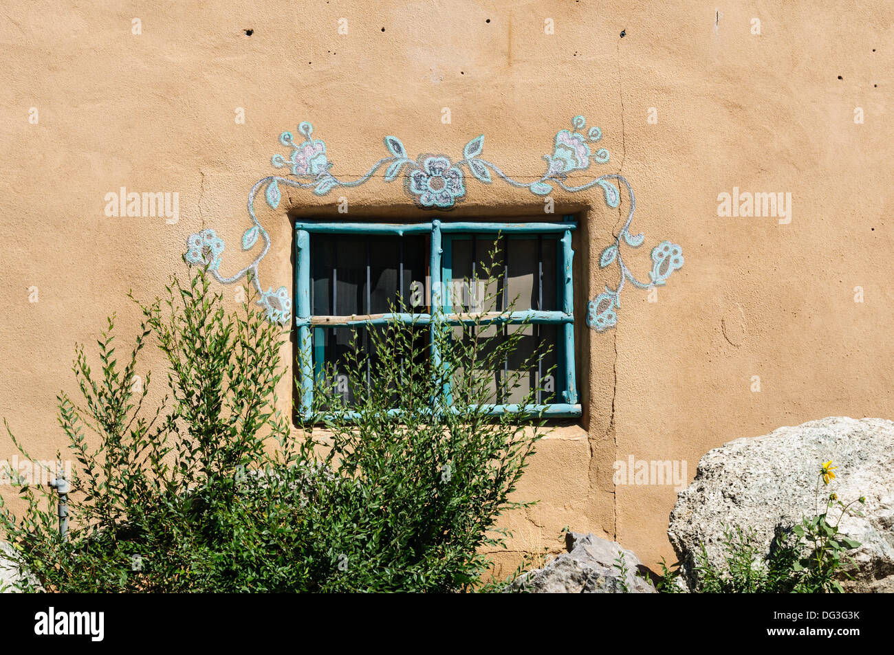 Flower Mural over Wndow, Ranchos de Taos, New Mexico Stock Photo