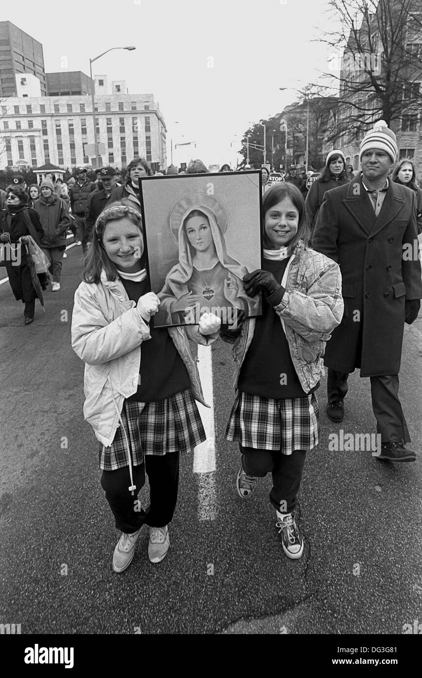Marist High School students join a Pro-Life rally in Atlanta, Georgia and hold a picture of Mary. Stock Photo