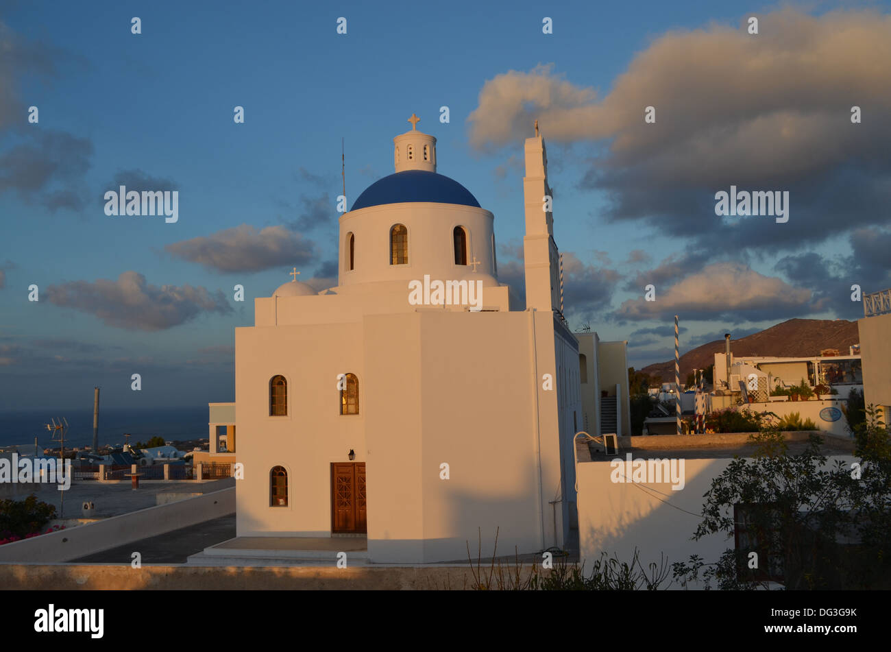 A beautiful old church on the island of Santorini in the Cyclades, Greece, beyond is the Aegen sea Stock Photo