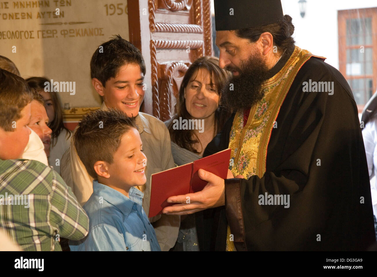 europe, greece, dodecanese, patmos island, chora, church of our lady the saviour, baptism ceremony Stock Photo
