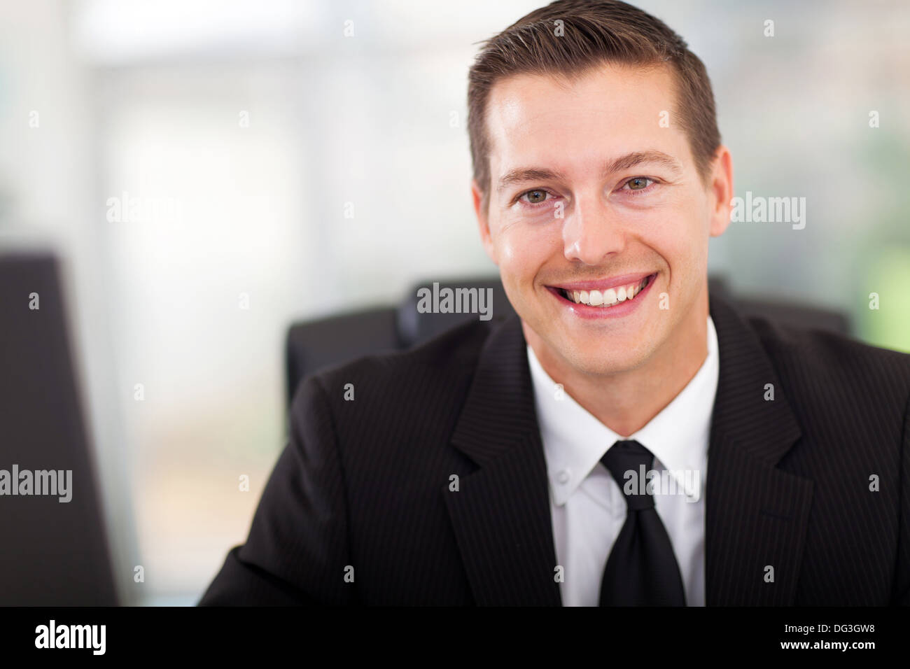 Handsome office worker in suit hi-res stock photography and images - Alamy