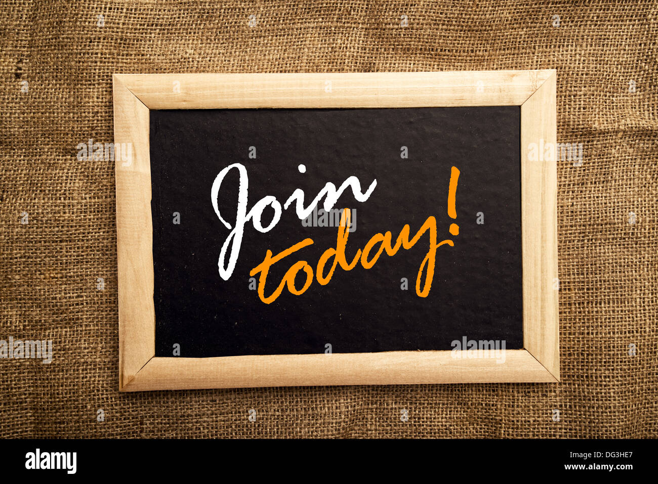 Join today note on black message board Stock Photo