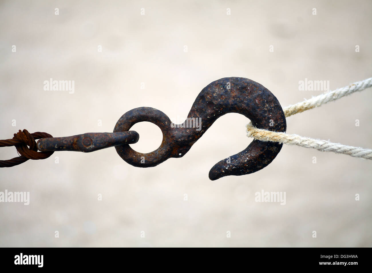 Color shot of a rusty hook and a rope Stock Photo