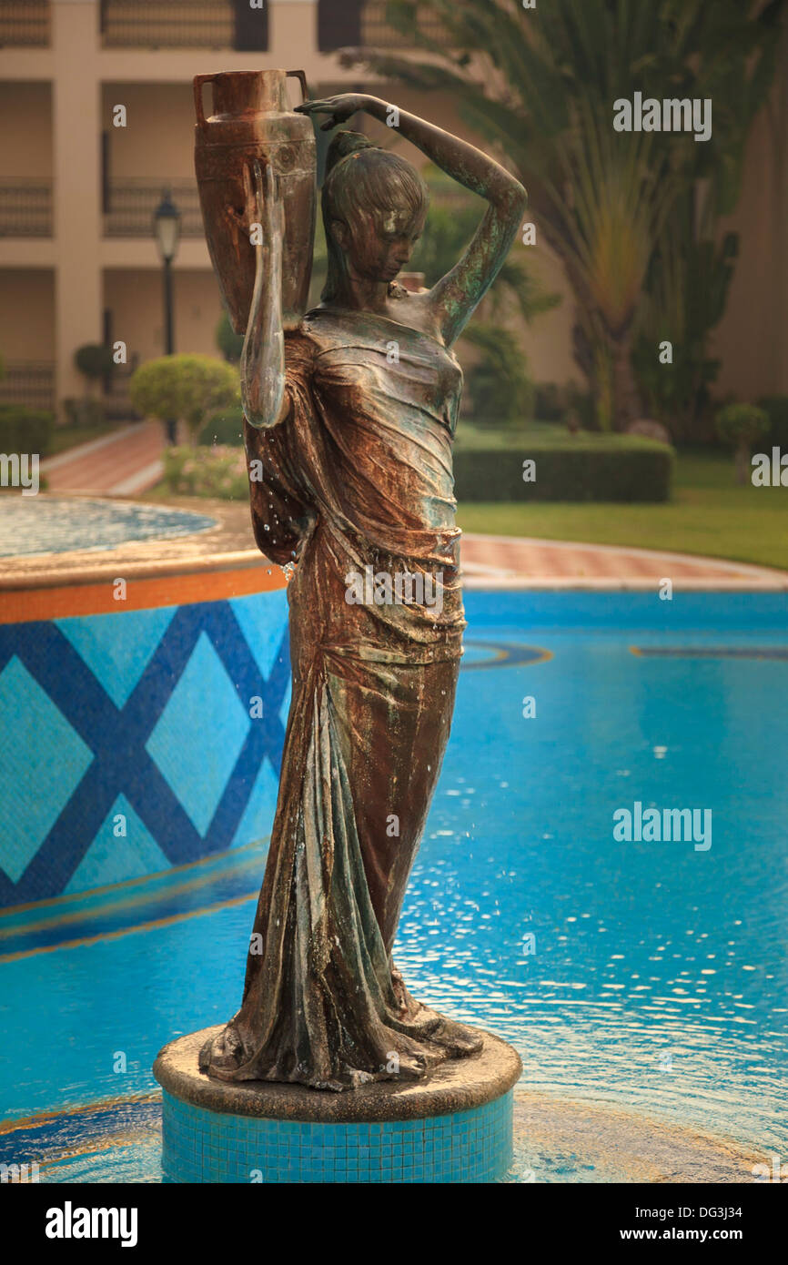 bronze statue in a water pool Stock Photo Alamy