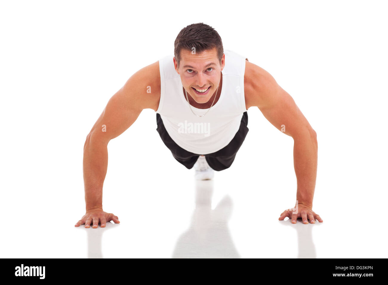fitness man doing push ups over white background Stock Photo