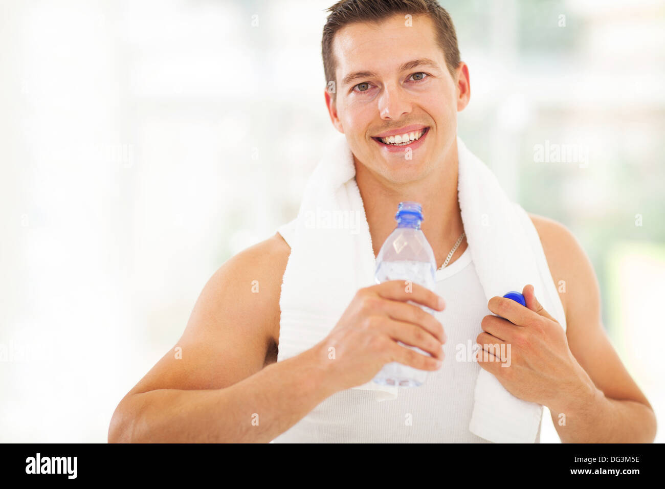 attractive fitness man drinking water after working out Stock Photo Alamy