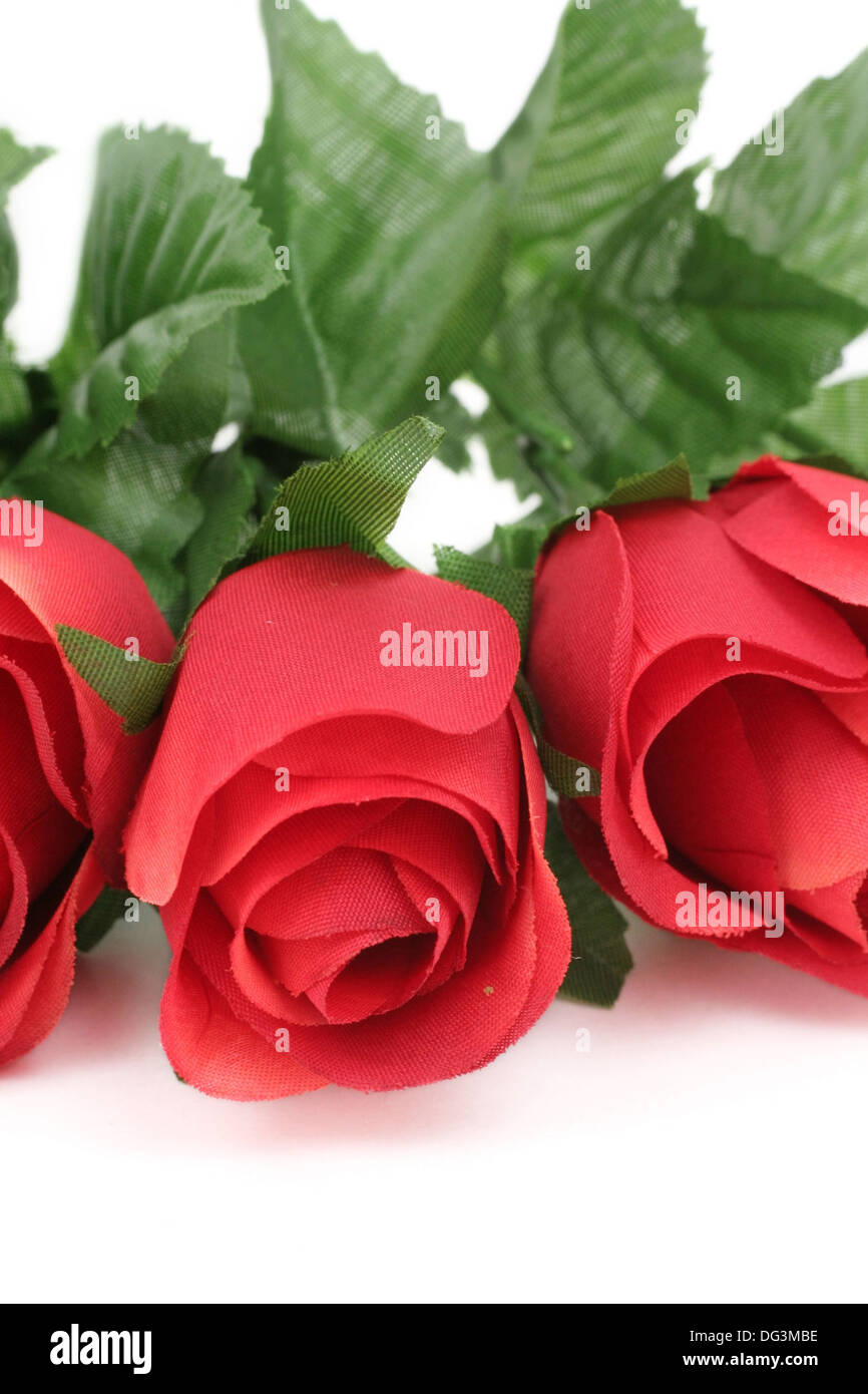 artificial red rose with white background Stock Photo