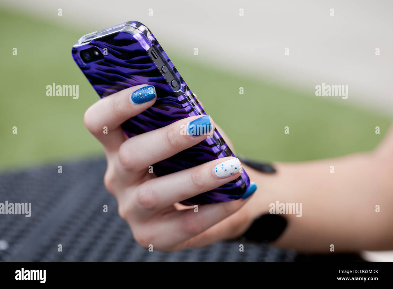 Closeup of woman's hand using smart phone - USA Stock Photo